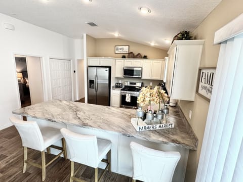 Fully Equipped Kitchen with Breakfast Bar and Seating
