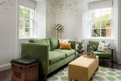 Grooms Cottage - comfortable two-seater sofa and chair in the sitting room