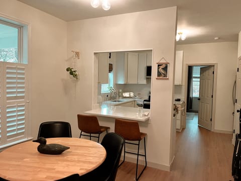 Table for 4 plus extra chairs in closet and barstools.