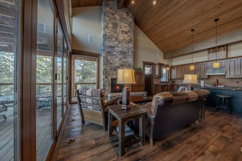 Bright living area with fireplace and deck access
