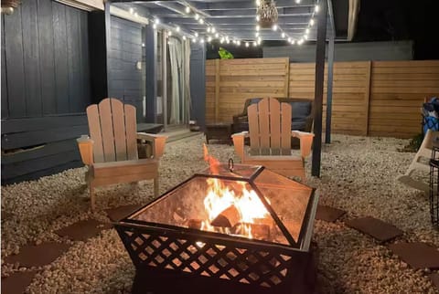 Relax and unwind by the private fire pit with comfortable Adirondack seating.