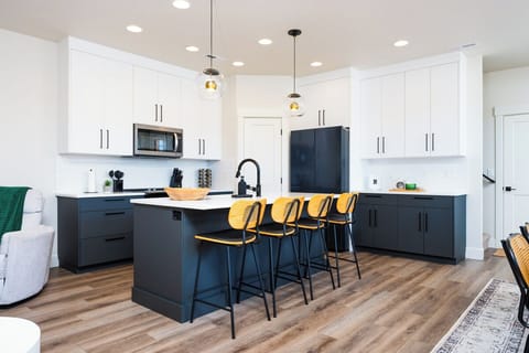 Enjoy all the comforts of home in this stunning kitchen, thoughtfully outfitted for family meals, casual snacks, and everything in between.