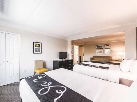 Recharge together with two comfy beds and soft lamplight.