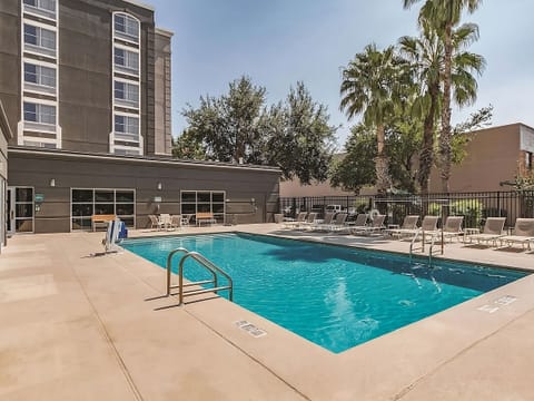 Cool off in the sparkling pool under sunny skies.