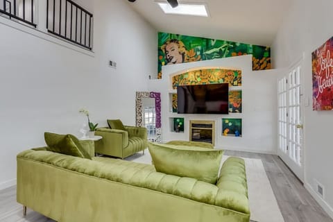 Pop Art Inspired Living Room with Smart TV and Plenty of Seating
