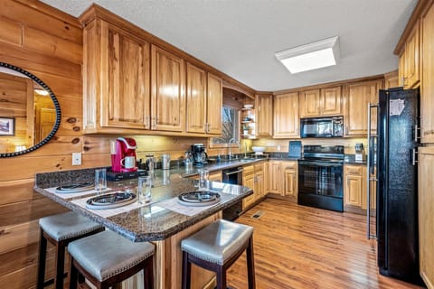 Fully stocked kitchen with modern appliances and rustic charmโperfect for home-cooked meals.