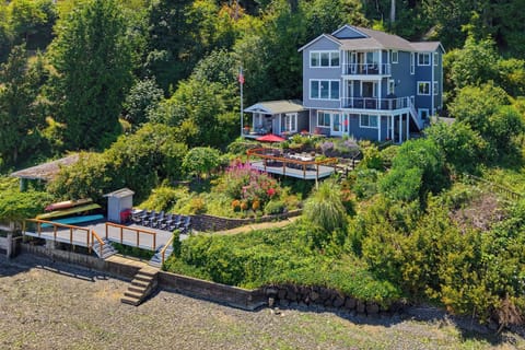 Private waterfront retreat with decks, fire pit, and beach access