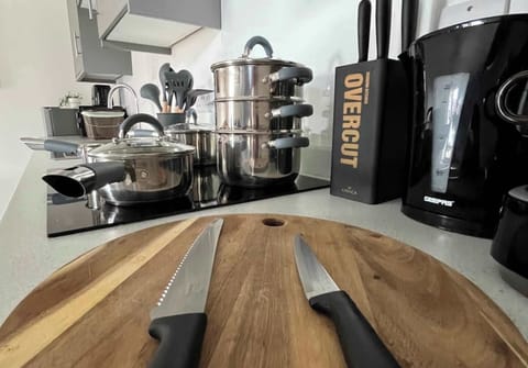 Saucepans, utensils, knives all supplied