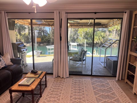 Main living area looking towards the back porch and water