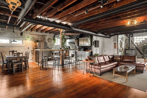Broad view of main living space including dinning room, kitchen and living room.