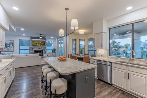 Fully stocked kitchen has both table and island seating.