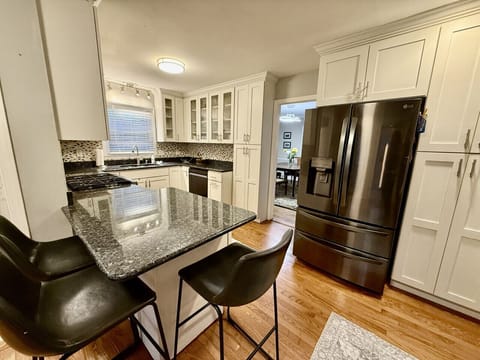 Fully kitchen with island to sit or prepare meals.