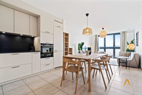 Spacious and modern open-plan kitchen and dining area. Fully equipped for your culinary adventures. Perfect for family meals or entertaining guests.
