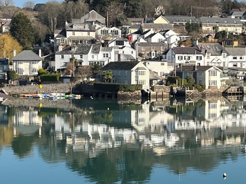 Hillside Cottage is tucked in behind the cottages in front of by the river