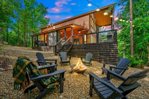 Gather under the stars with cozy seating and a glowing fire.
