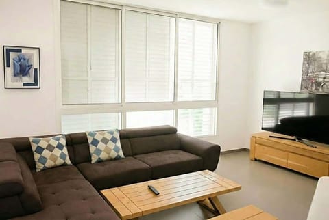 Bright living area ideal for relaxing after short three-minute walks returning easily from the nearby sea.