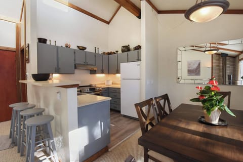 Kitchen with drip coffee pot, dishwasher, slow cooker and electric stovetop