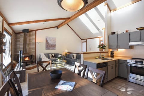 Upstairs with living room, dining table and kitchen