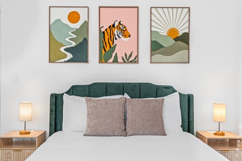 Cozy Bedroom w/ velvet bed and art