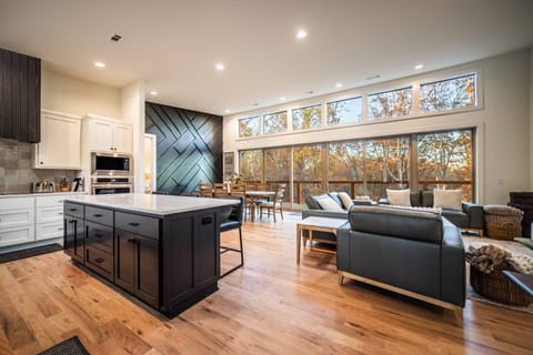 [Kitchen and Living Room] Large Tv and Space for entertaining! Kitchen extremely well equipped for anything you and your group may need!