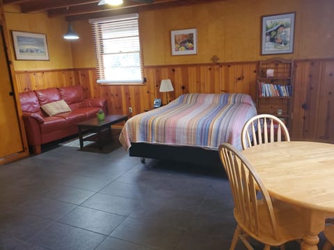 Studio with sofa area and table for eating, playing, or working