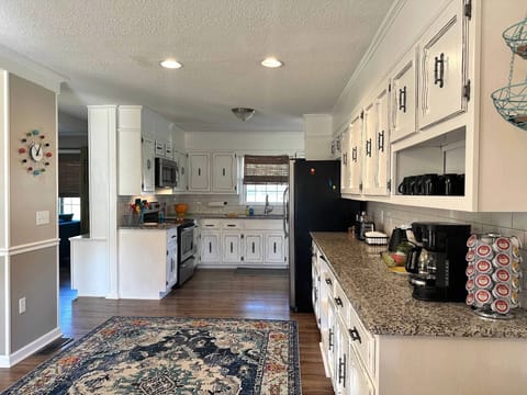 Full Kitchen w/oven, microwave, fridge, dishwasher & numerous cooking utensils