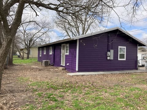 Backyard view of The Purple House, a private and serene outdoor space in the heart of Stephenville
