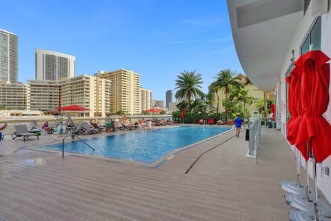 Swimming pool with sun loungers and towel service