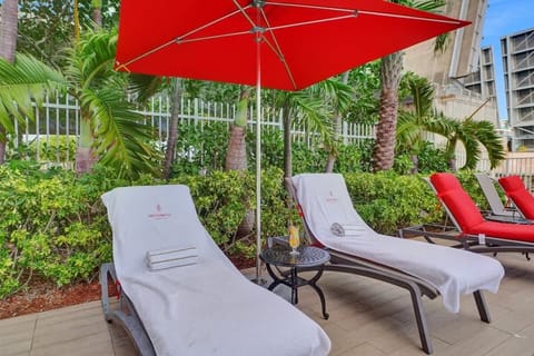 Swimming pool with sun loungers and towel service