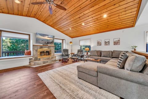 Living room: Smart TV, wood-burning fireplace, central heating, no A/C
