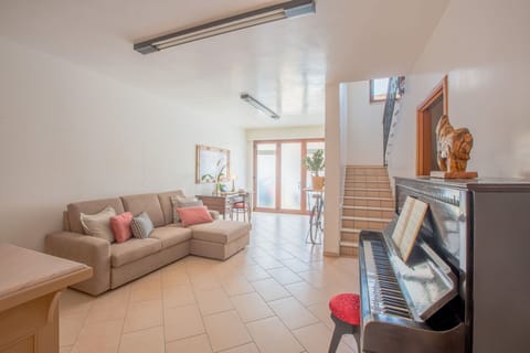 Furniture, Interior Design, Flooring, Floor, Wood, Ceiling, Room, Couch, Lighting, Table