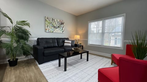 Unwind in our cozy living room, complete with a comfy couch and Smart TV for the perfect night in!