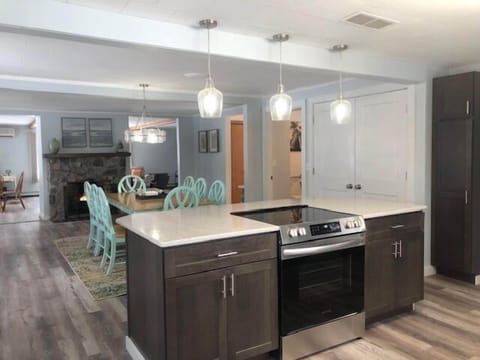 Kitchen/Dining Area - Brightly lit Kitchen facing towards Dining Area