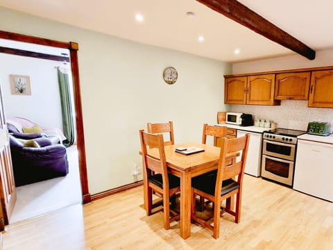 Large, well equipped kitchen with family sized dining table and chairs