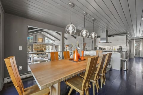 Bright dining nook with panoramic views, seamlessly connected to the kitchen for effortless entertaining.