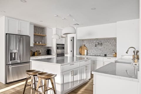 Bright and modern kitchen with sleek finishes and plenty of space to cook and gather.