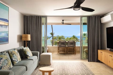 Living room in second unit. Lanai with panoramic 180° ocean, sunset, West Maui Mountain and Lanai Island views. 75` 4K smart Sony TV. Sonos soundbar. AC throughout. The lanai sliders open up to create indoor outdoor living Hawaii style.