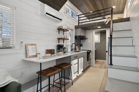 The perfect space for two—enjoy relaxed mornings with breakfast at the bar, cozy up for a movie night, or simply unwind together in this thoughtfully designed retreat.