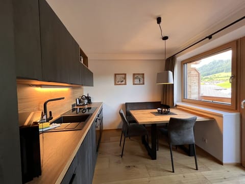 Furniture, Window, Countertop, Cabinetry, Building, Table, Wood, Kitchen, Kitchen Appliance, Kitchen Stove