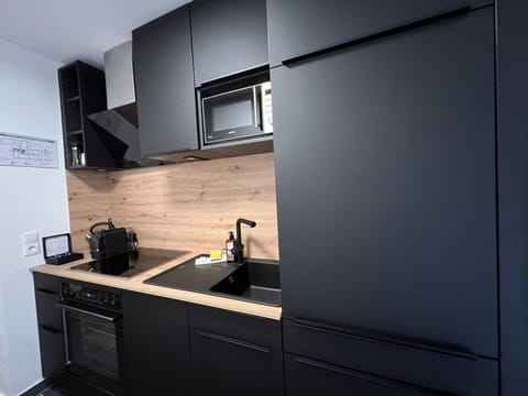 Cabinetry, Kitchen Sink, Sink, Countertop, Tap, Building, Kitchen, Wood, Kitchen Stove, Floor