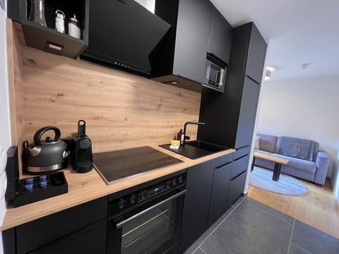 Countertop, Cabinetry, Property, Furniture, Kitchen, Kitchen Stove, Kitchen Appliance, Drawer, Building, Wood