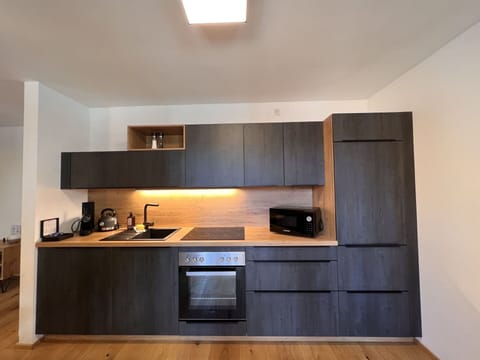 Cabinetry, Countertop, Property, Building, Kitchen Stove, Kitchen Appliance, Kitchen, Wood, Interior Design, Home Appliance