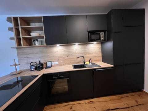 Tap, Cabinetry, Kitchen Sink, Sink, Countertop, Property, Kitchen, Kitchen Stove, Plumbing Fixture, Interior Design