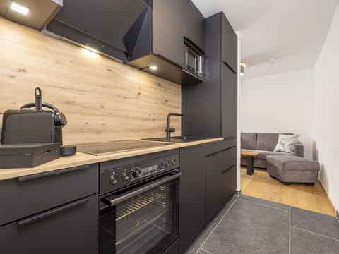 Cabinetry, Furniture, Property, Countertop, Building, Kitchen Stove, Kitchen, Kitchen Appliance, Wood, Cooktop