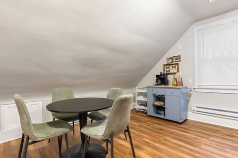 Dining area under sloped ceiling, ideal for memorable gatherings.