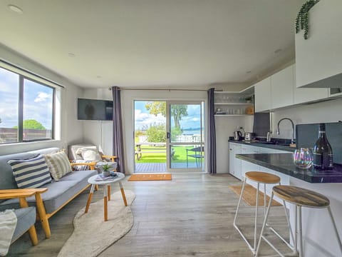 Open plan living and kitchen area - open the doors to the Waterview!