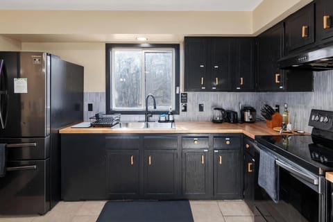 Another view of fully stocked kitchen, with stove and oven