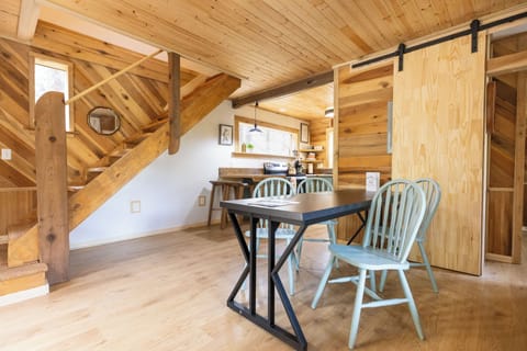 Relax in the warm, wood-paneled living space—perfect after hiking in Red River Gorge.