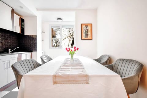 Enjoy meals in the bright and elegant dining area, perfect for gathering with friends or family.