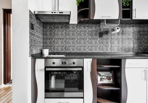 Prepare your favorite dishes in this well-appointed kitchen, complete with a stylish backsplash and all the essentials.